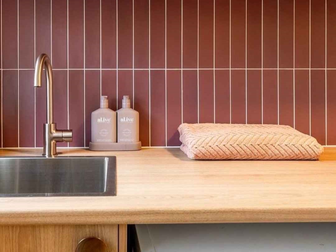 bathroom sink with a towel laid on the counter